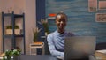 African-american woman looking at camera smiling working at pc Royalty Free Stock Photo