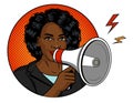 African American woman with a loudspeaker in her hand. Royalty Free Stock Photo