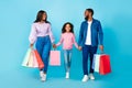 African American woman, man and girl walking with shopping bags Royalty Free Stock Photo