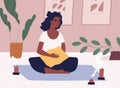 African American woman meditating and performing yoga at home in solitude. Relaxed female character practicing