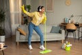 African American Woman Mopping Floor Singing Having Fun Cleaning House Royalty Free Stock Photo