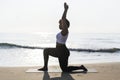 African American woman practicing yoga at the beach Royalty Free Stock Photo