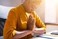 African American Woman Praying In Office Royalty Free Stock Photo