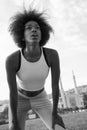 African american woman running across the bridge Royalty Free Stock Photo