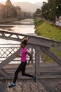 African american woman running across the bridge Royalty Free Stock Photo