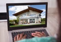 African american woman selecting new house on laptop at home Royalty Free Stock Photo