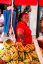 African American woman sells banana
