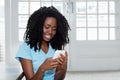 African american woman sending message with phone Royalty Free Stock Photo