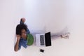 African american woman sitting on floor with laptop top view Royalty Free Stock Photo