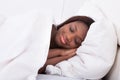 African american woman sleeping in bed Royalty Free Stock Photo