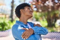 African american woman smiling confident hugging himself at park Royalty Free Stock Photo