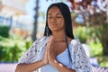 African american woman smiling confident praying at park Royalty Free Stock Photo