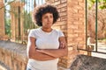 African american woman standing with arms crossed gesture and serious expression at street Royalty Free Stock Photo