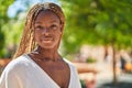 African american woman standing with serious expression at park Royalty Free Stock Photo