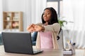 African american woman stretching at home office