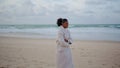 African american woman strolling ocean shore. Thoughtful traveler watching waves