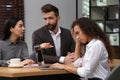 African American woman suffering from racial discrimination at work Royalty Free Stock Photo