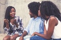 African american woman telling story to friends