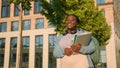 African American woman university college academy campus student teen girl high school schoolgirl with books schoolbag Royalty Free Stock Photo