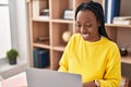 African american woman using laptop sitting on table at home Royalty Free Stock Photo