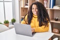 African american woman using laptop sitting on table at home Royalty Free Stock Photo