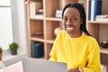 African american woman using laptop sitting on table at home Royalty Free Stock Photo