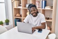 African american woman using laptop sitting on table at home Royalty Free Stock Photo