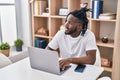 African american woman using laptop sitting on table at home Royalty Free Stock Photo