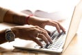 African American woman using laptop, typing on keyboard, close u Royalty Free Stock Photo