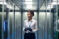 Woman with tablet diagnosing server hardware Royalty Free Stock Photo