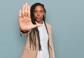 African american woman wearing business jacket doing stop sing with palm of the hand Royalty Free Stock Photo