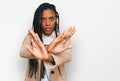 African american woman wearing business jacket rejection expression crossing arms and palms doing negative sign, angry face Royalty Free Stock Photo