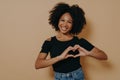 African american woman wearing casual clothes showing love gesture with heart shaped fingers