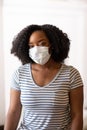 Close up view of an African American woman wearing a face mask Royalty Free Stock Photo