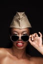 African American woman wearing a military cap and sunglasses with lots of attitude, Beauty model for cosmetic makeup treatments