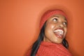 African-American woman wearing orange scarf and hat. Royalty Free Stock Photo