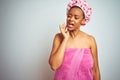 African american woman wearing pink shower towel after bath over isolated background touching mouth with hand with painful Royalty Free Stock Photo