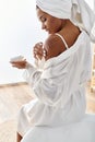 African American woman in white dress