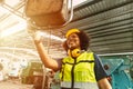 African American woman worker happy smiling working operate machine in heavy industry factory Royalty Free Stock Photo