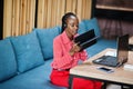 African american woman works in a call center operator and customer service agent wearing microphone headsets working on laptop Royalty Free Stock Photo