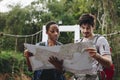 African American woman and a Caucasian man looking at a map together travel and teamwork concept Royalty Free Stock Photo