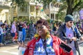 African American Woman Enjoying the Krewe of Carrollton Carnival Parade in New Orleans Royalty Free Stock Photo