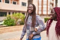 African american women friends standing together speaking at park Royalty Free Stock Photo