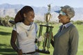 African American Women Holding Trophy