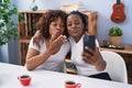 African american women mother and daughter having video call at home Royalty Free Stock Photo