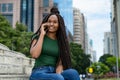 African american young adult woman with amazing hairstyle at phone Royalty Free Stock Photo