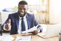 African american young businessman extending hand to shake Royalty Free Stock Photo