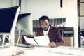 African-American young businessman reading the financial reports