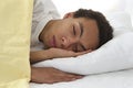 African american young male sleeping in bed