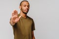 African american young man gesturing STOP with his hand over light grey background Royalty Free Stock Photo